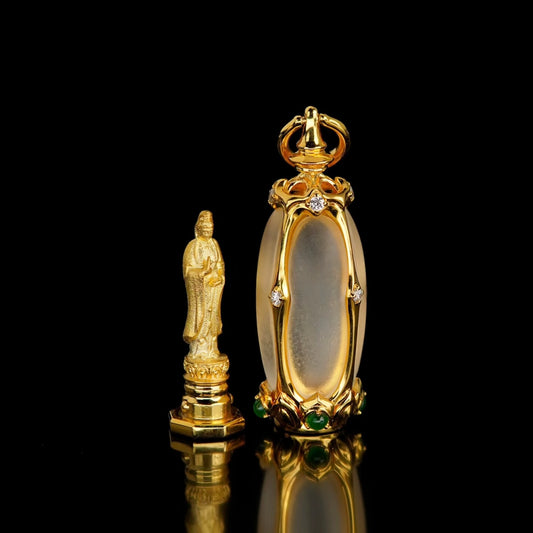 Openable 18K gold shrine pendant open to reveal 1.3cm Buddha statue inside crystal chamber