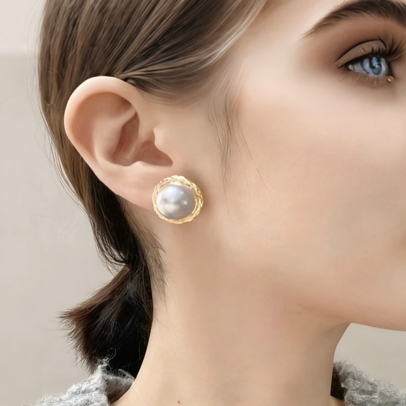 woman wearing blue mabe pearl earrings Singapore fine jewelry gif
