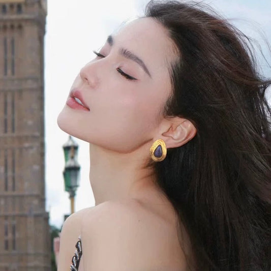 Model wearing the 24mm Celestial Tear studs, showcasing the bold statement scale and vintage vibe.