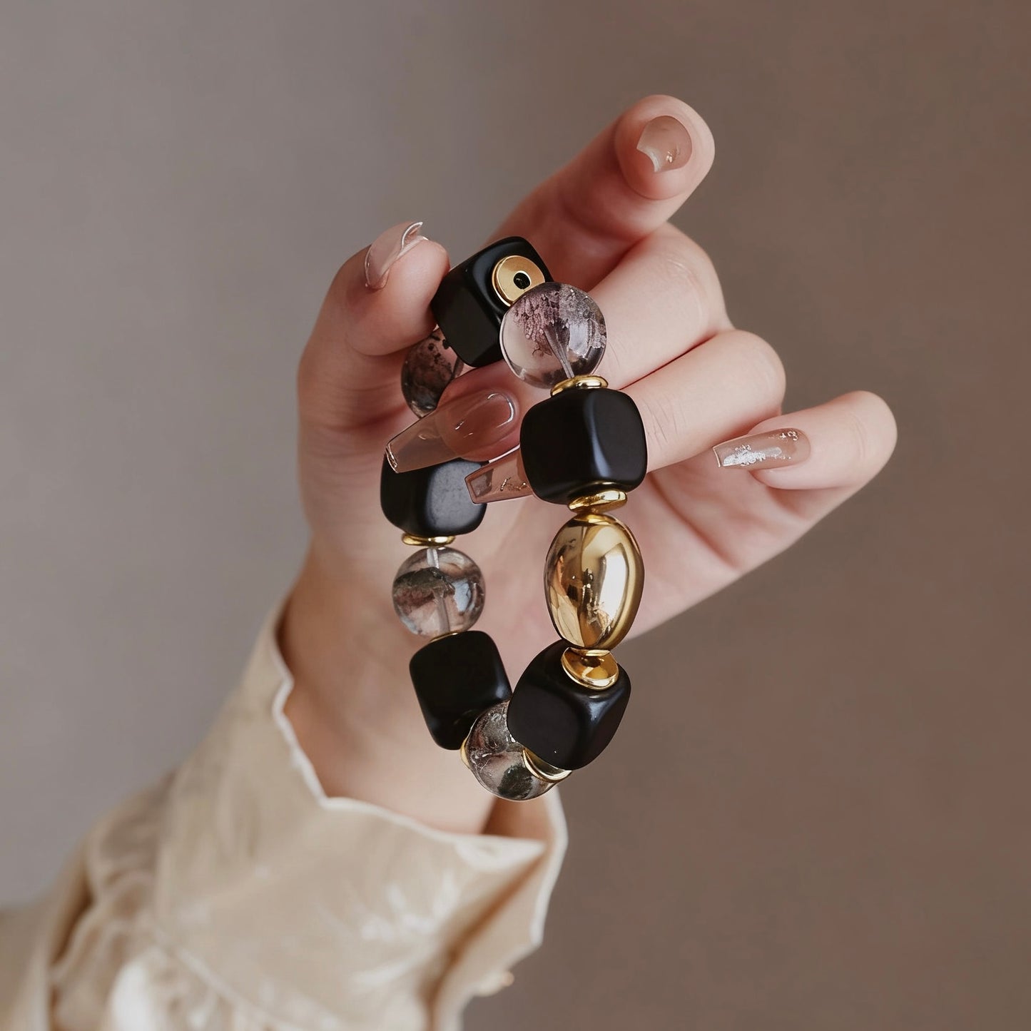 Minimalist display of the ebony and phantom crystal bracelet, highlighting its elegant and tarnish-resistant finish.