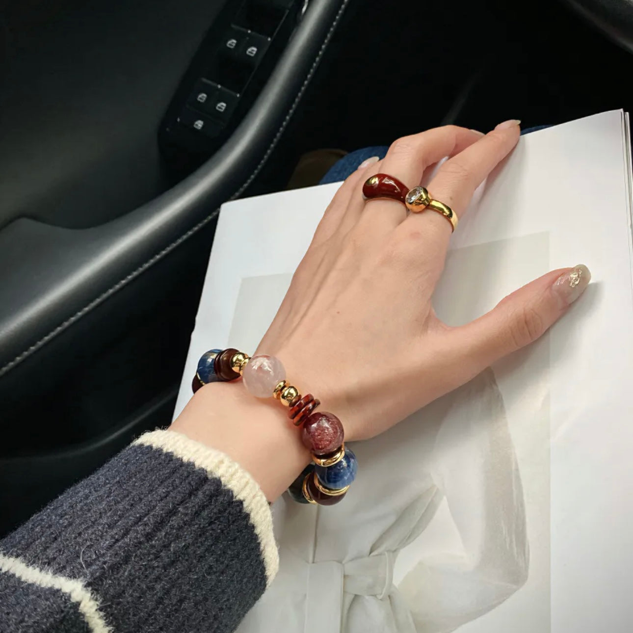 Model wearing Realm Crimson Glow healing crystal bracelet - luxury custom DIY jewelry 2026 Gentle Crystals