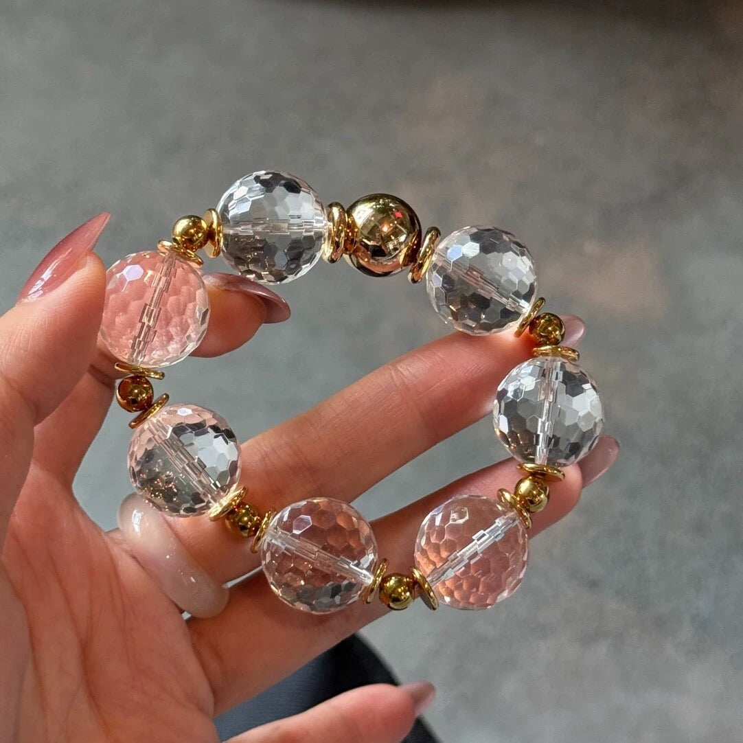 Capturing the sparkling brilliance of the faceted quartz beads as they catch light during movement.