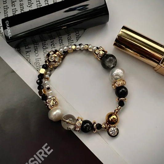 Starlight Aura Quartz and Freshwater Pearl statement bracelet with 24K gold-plated titanium steel hardware, flat lay on neutral background