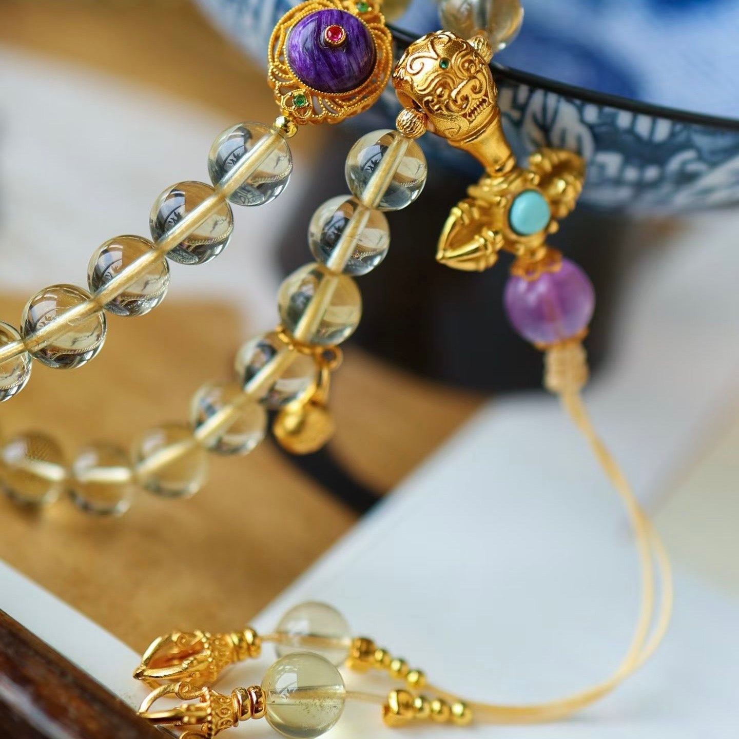 The citrine mala necklace placed in morning sunlight to capture its warm energy.