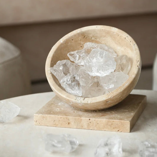 Top-down view showing 7-8 pieces of unique natural Himalayan crystals arranged in the stone bowl