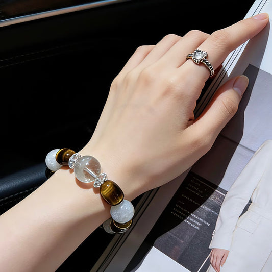 Handheld view of the substantial 14-16mm Obsidian Earth bracelet, showcasing Tiger's Eye and cubic Clear Quartz.