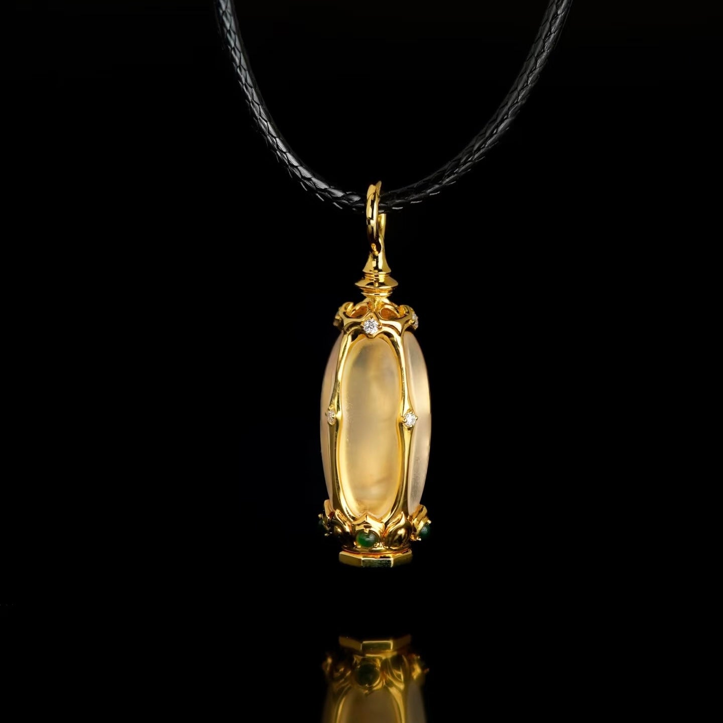 18K gold crystal Buddhist pendant displaying hidden pattern revealed on contact with water