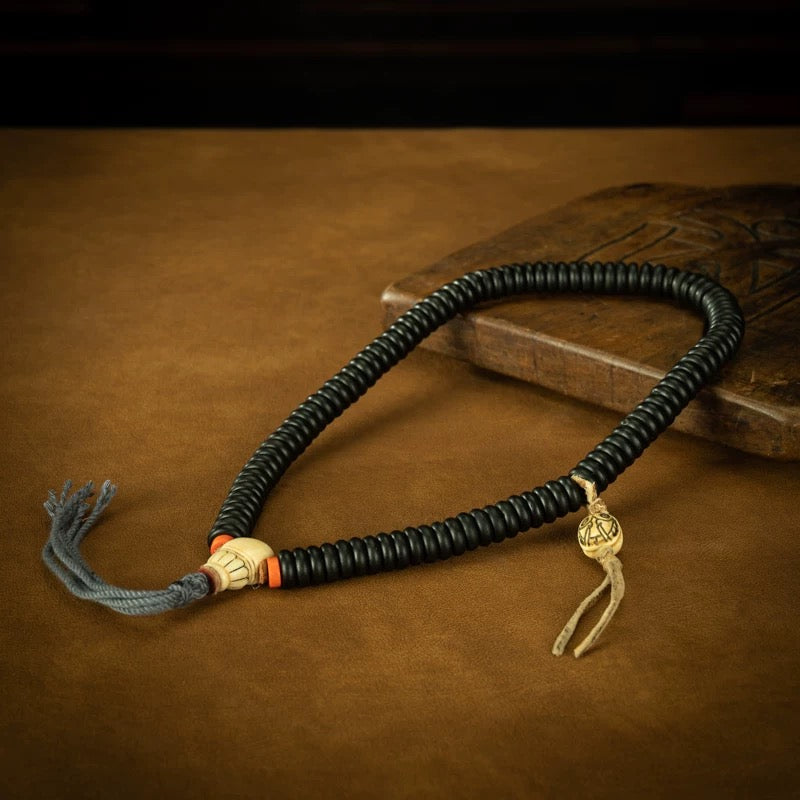 Close-up of the century-aged glass-like patina on antique red sandalwood.
