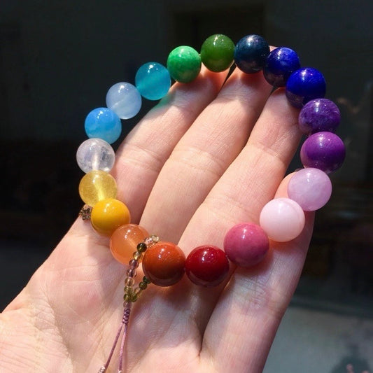 A full-spectrum rainbow bracelet featuring 22 different natural crystals in a circular display.