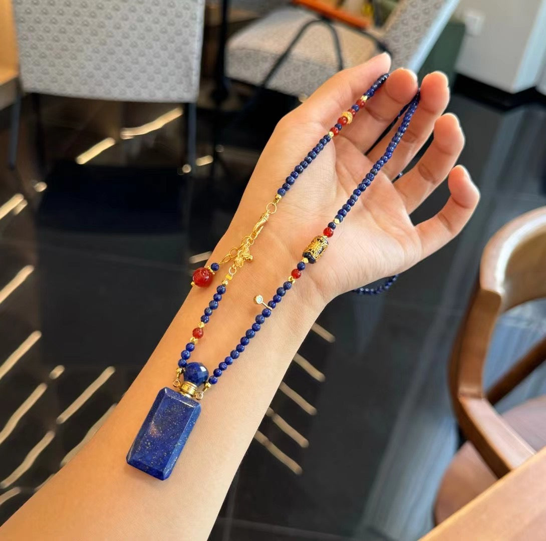 Macro shot of the delicate 3.6mm lapis beads and gold-plated copper hardware.