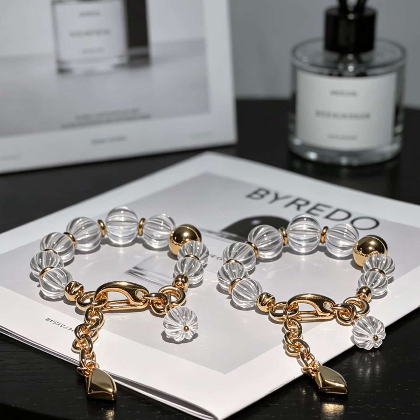 Detailed view of the heavy-duty 316 titanium steel lobster clasp and chain, highlighting the tarnish-resistant gold finish.