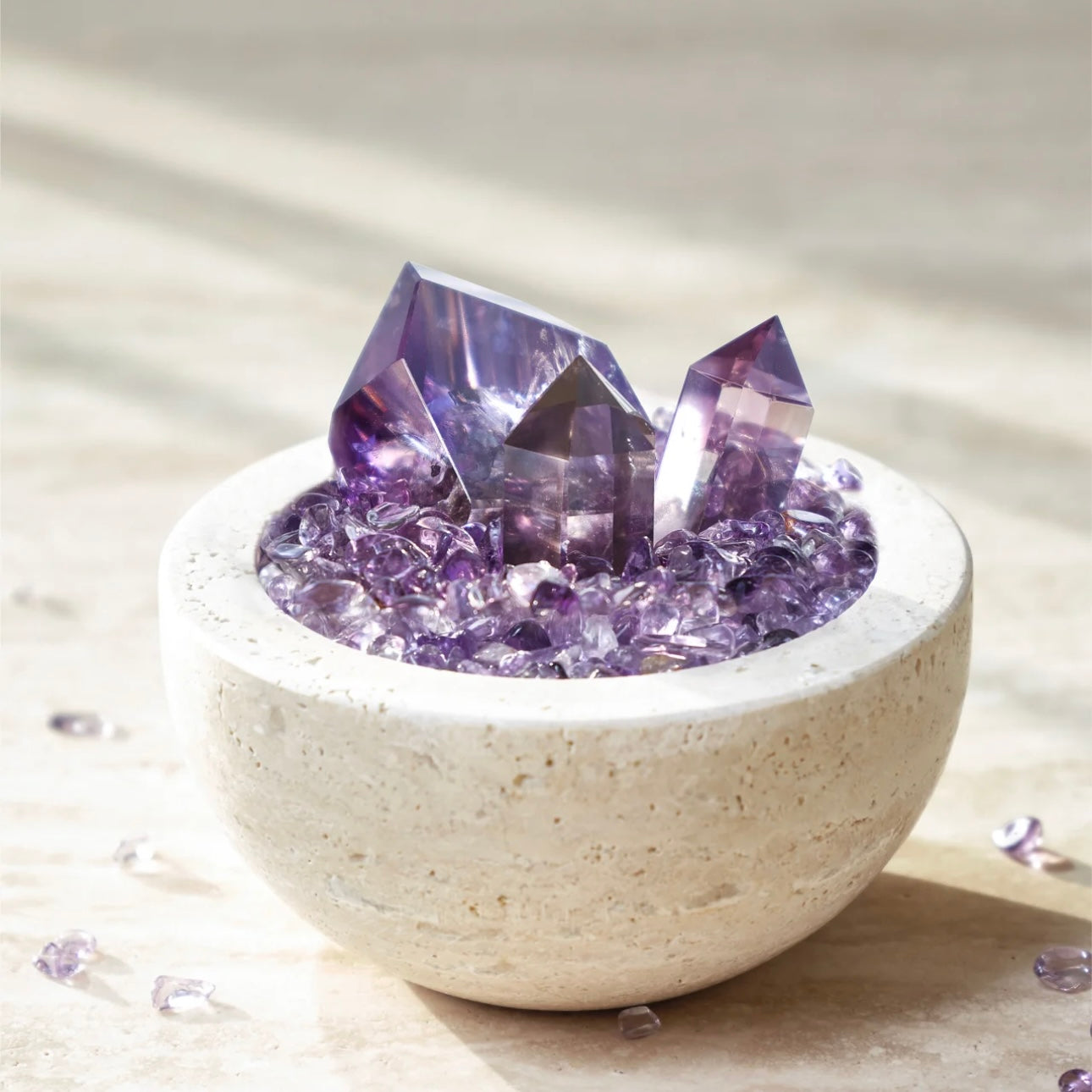 Natural Amethyst Energy Purification Ornament with 3 points and chips in a cave stone vessel.