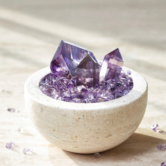 Natural Amethyst Energy Purification Ornament with 3 points and chips in a cave stone vessel.