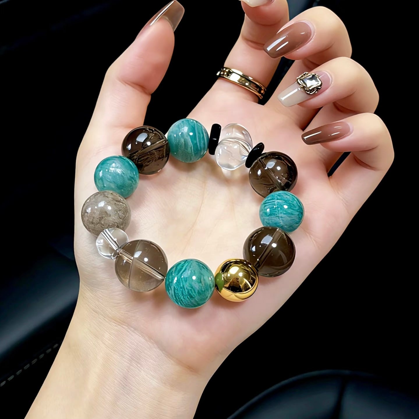 Modern styling of the Azure Smoke bracelet on a wrist, representing the luxury natural energy collection by Gentle Crystals.