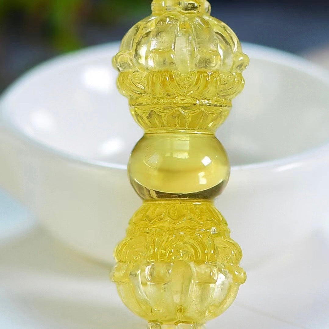 Angled view of Brazilian Yellow Crystal Vajra Pendant showing three-dimensional nine-pronged dharma instrument form