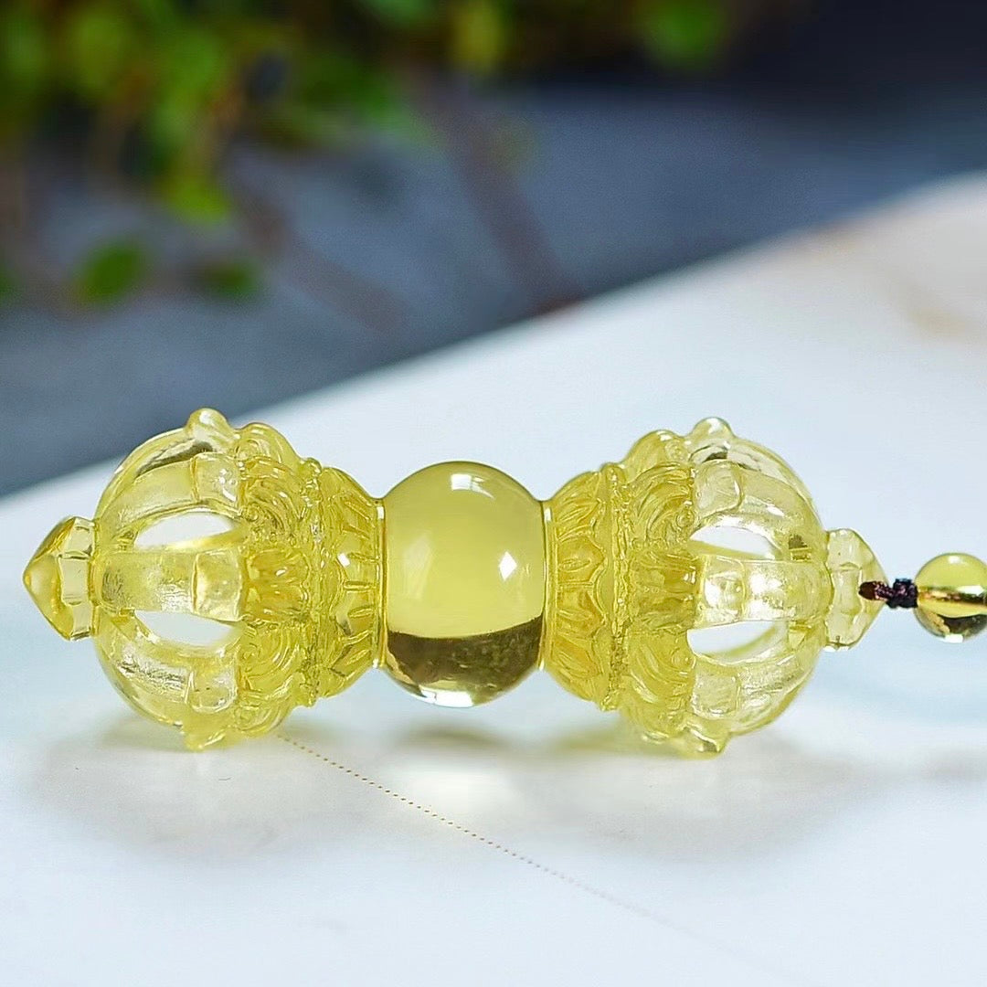 Yellow Crystal Vajra Pendant with elegant gift box on neutral surface showing size and packaging presentation
