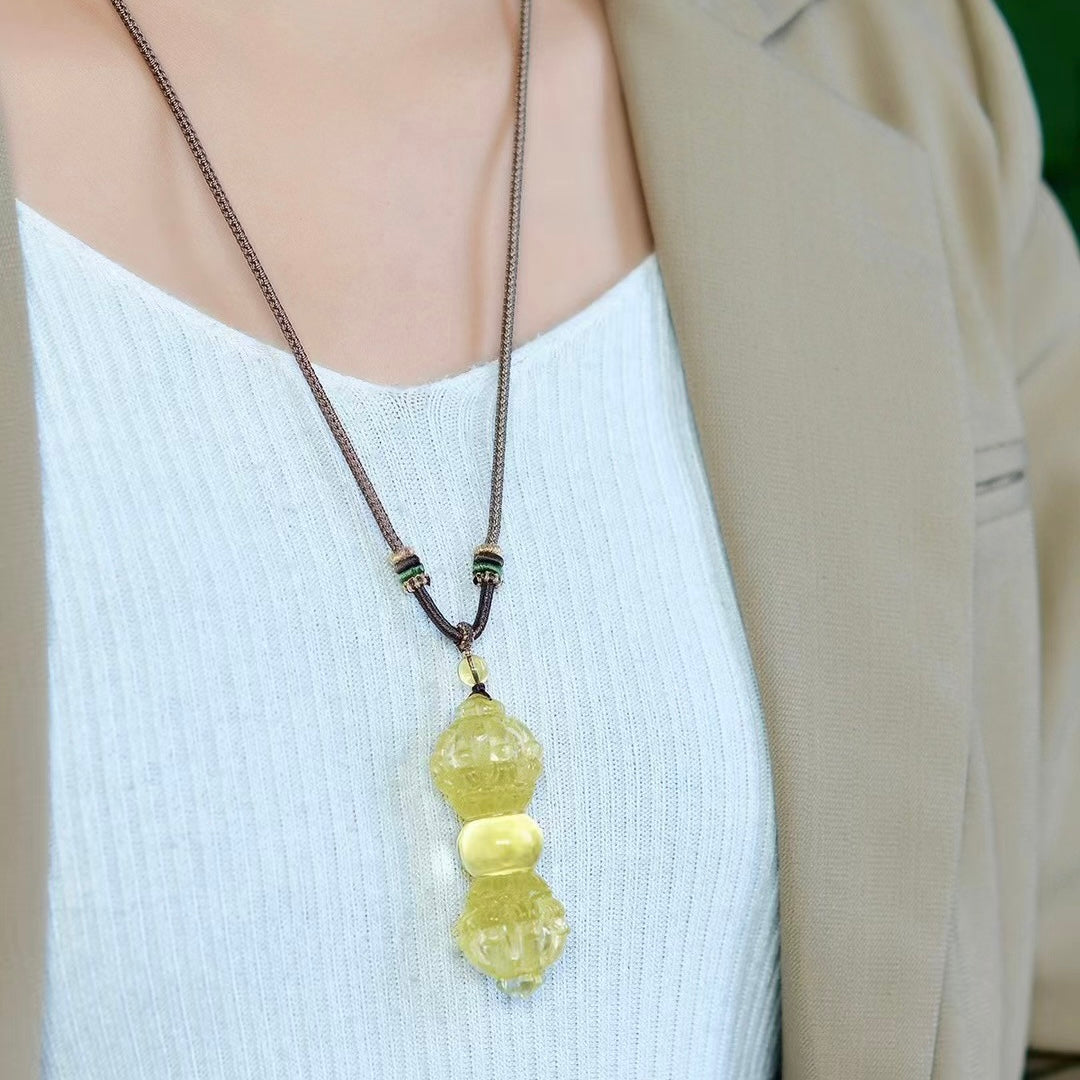 Model wearing Brazilian Yellow Crystal Nine-Pronged Vajra Pendant as necklace showing scale and wearable styling