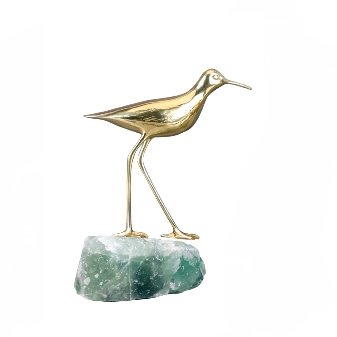 Minimalist bronze bird ornament standing on a raw green fluorite mineral base, elegant home decor.