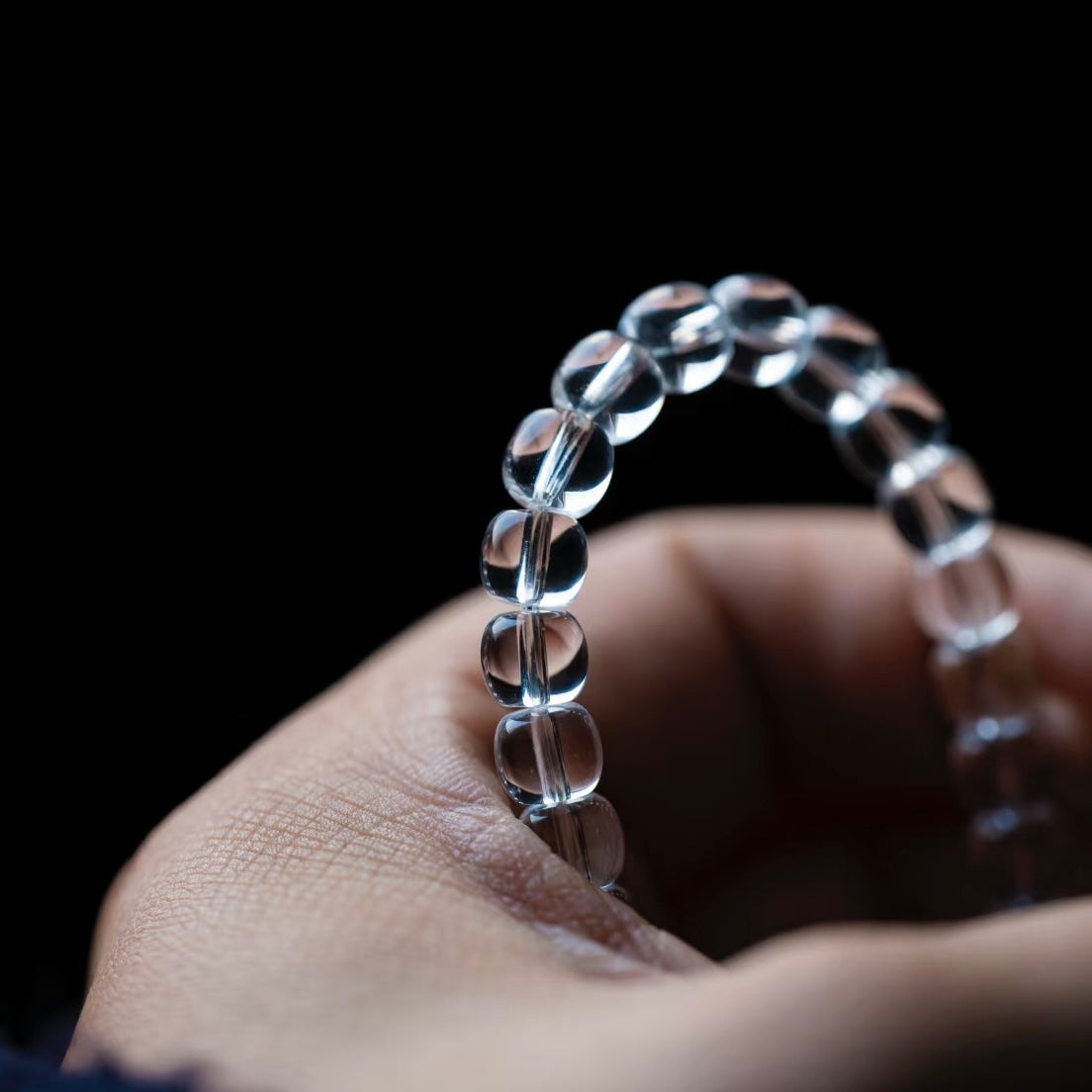 Showing the perfect geometric symmetry of artisan-made quartz barrel beads.