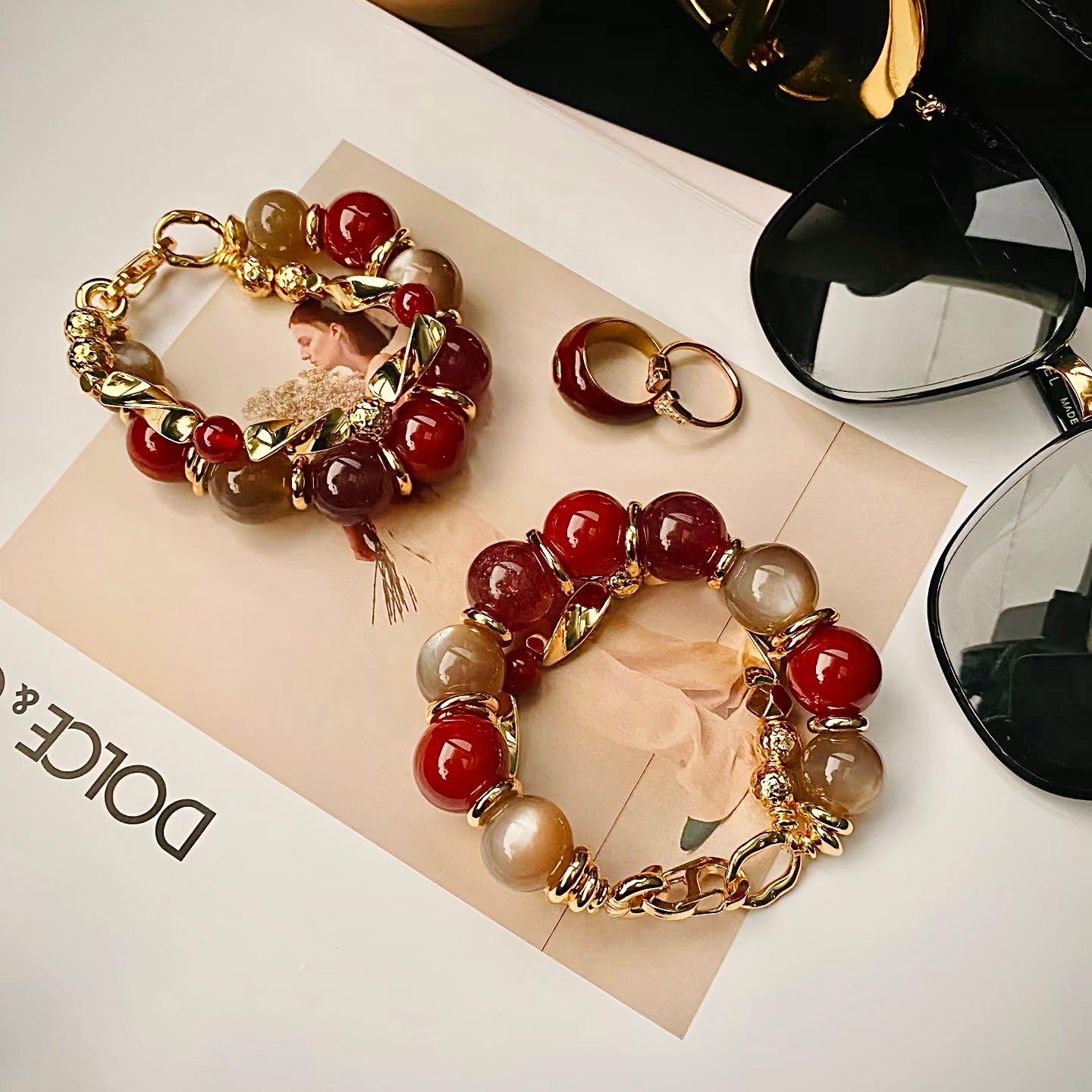 Close-up of high-gloss carnelian beads and durable 24K gold-plated titanium steel hardware.