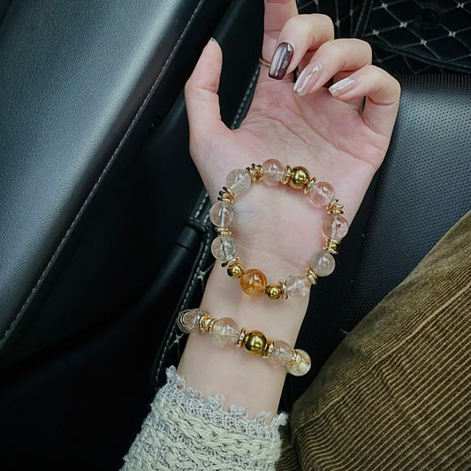 Hand model wearing a natural Citrine Tower Crystal bracelet with Smoky White Azeztulite, styled for everyday jewelry and modern minimalist fashion.