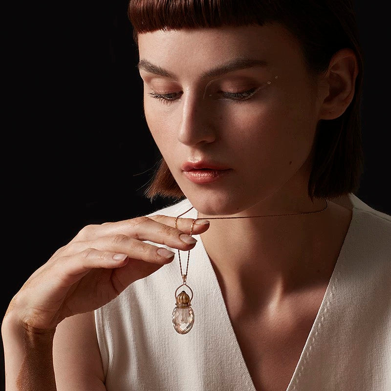 Model wearing the Clear Quartz perfume bottle necklace, showcasing the elegant 40mm pendant and 925 silver chain.