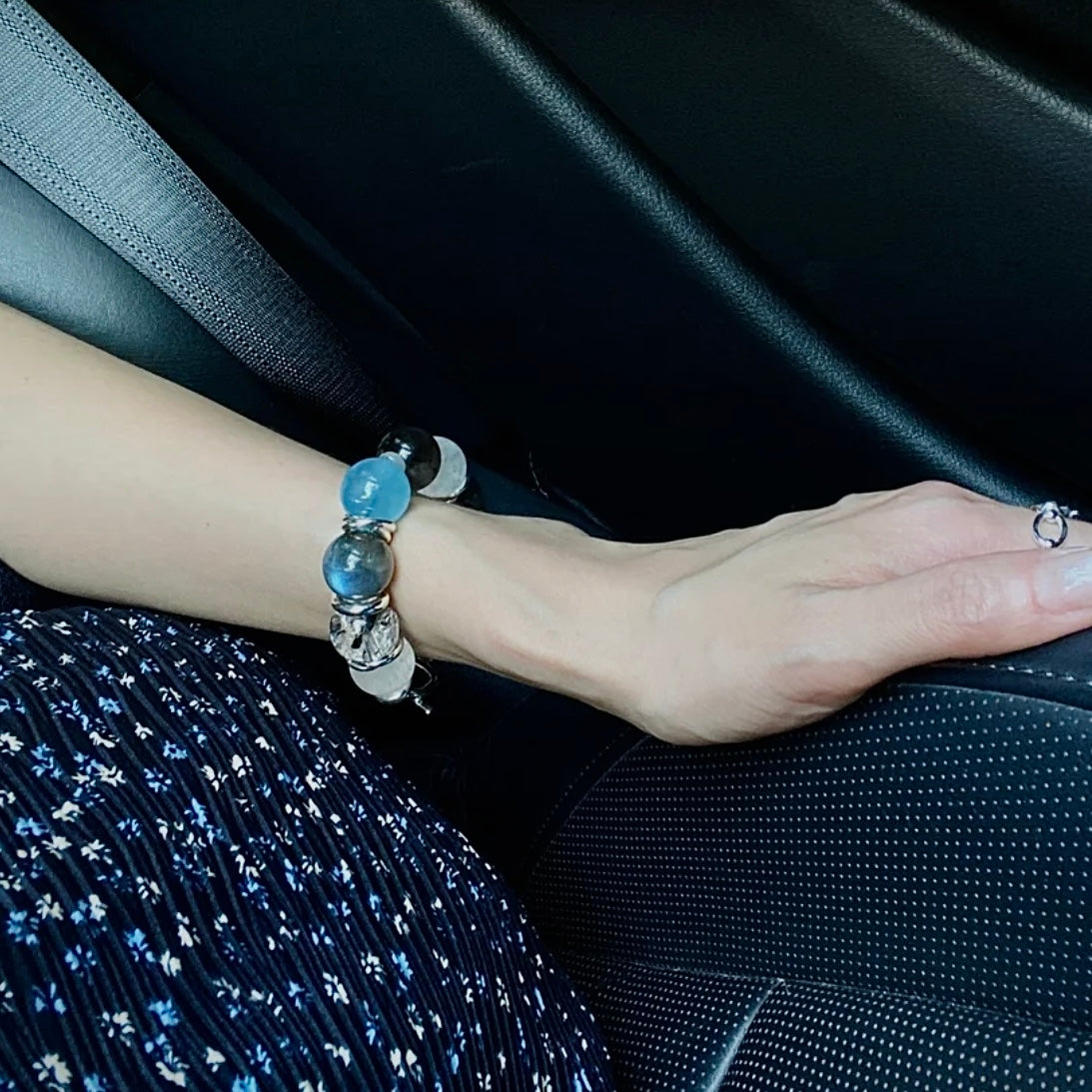 Natural Aquamarine and Moonstone bracelet paired with a neutral wardrobe, showcasing versatile crystal jewelry styling for modern everyday wear.