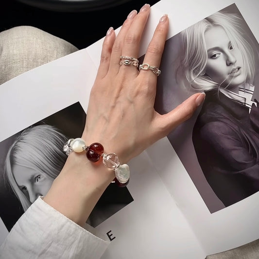 Crimson Solitude blood amber pearl and clear crystal beaded bracelet, 14–16mm, cool-toned red