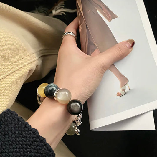 Model wearing Tiger's Eye & Lepidolite crystal bracelet – feng shui healing jewelry by Gentle Crystals