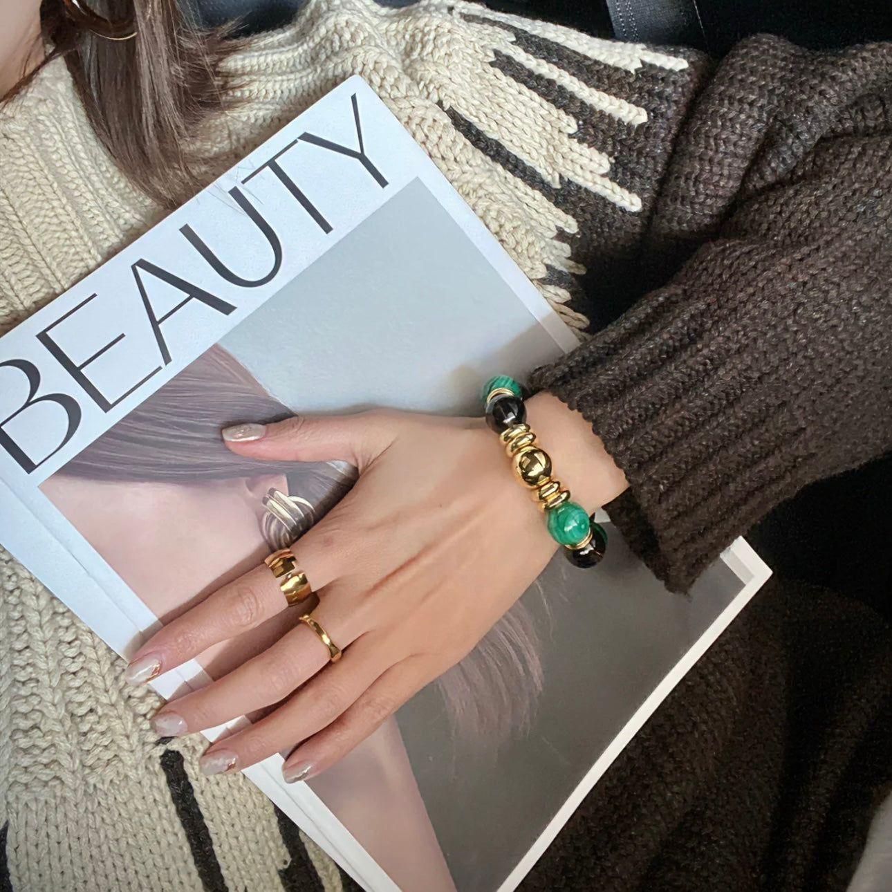 The designer gemstone bracelet displayed against rich textures, highlighting its noble color palette.