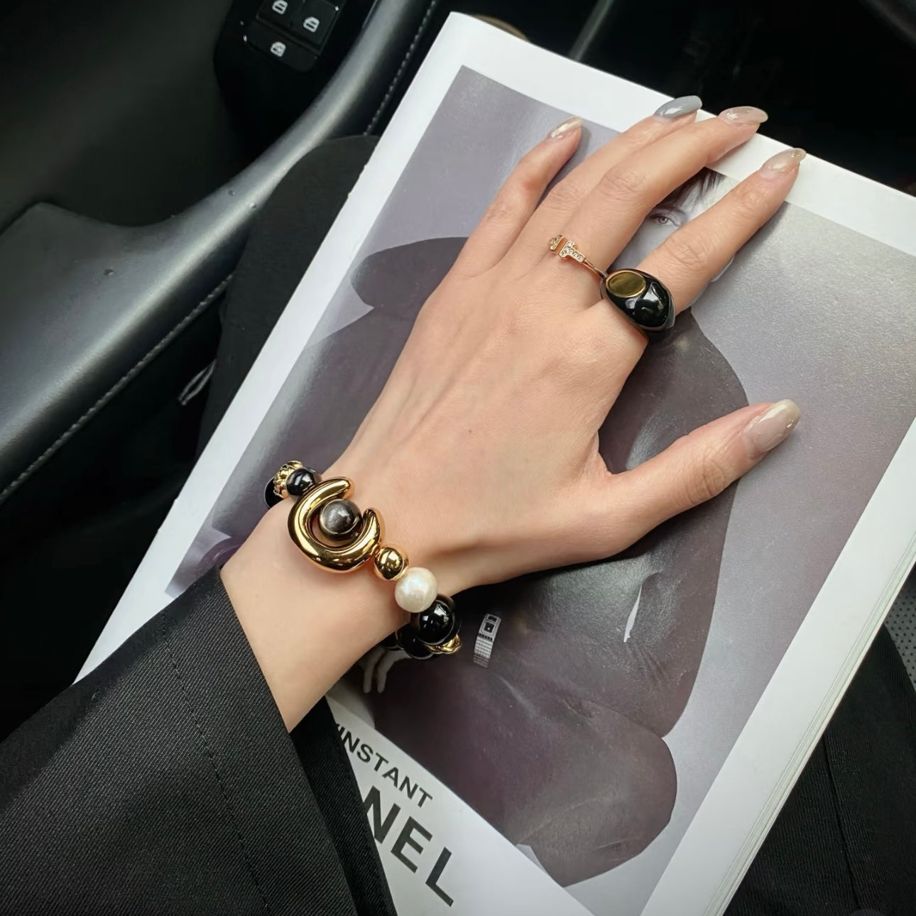 ECLIPSE statement bracelet worn on wrist, showcasing multi-stone design with 24K gold titanium steel hardwar