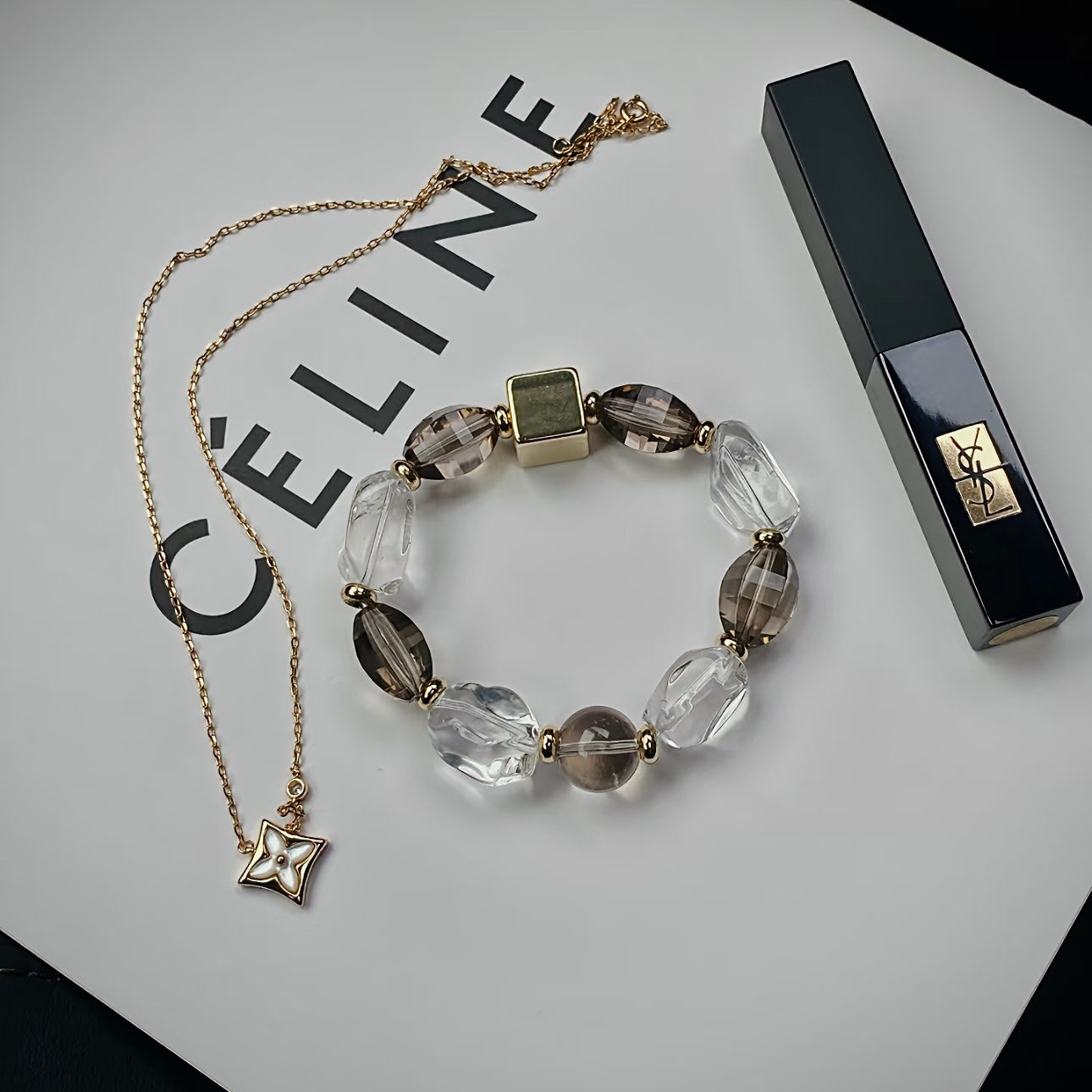 Natural Smoky Quartz and Clear Quartz bracelet featuring freeform gemstone beads styled in a minimalist flat lay for everyday wear.