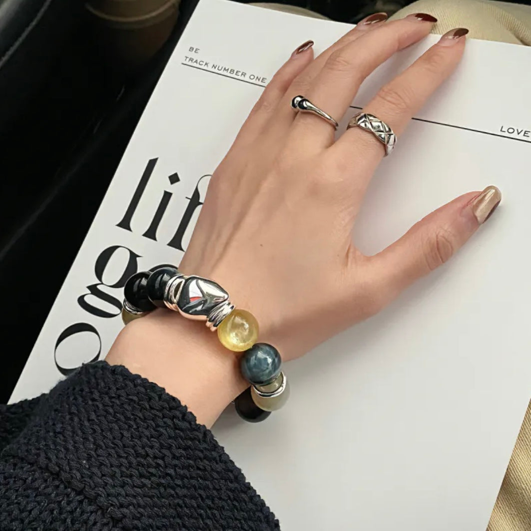 Lifestyle wrist photo of Moonstone & Obsidian crystal bracelet – meaningful gift for her