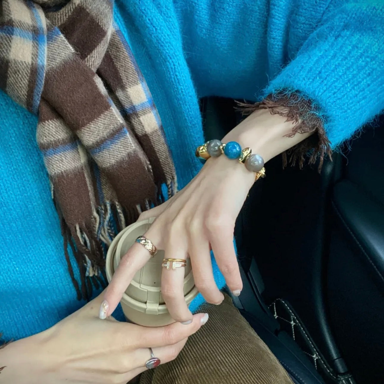Hand model wearing Twilight Tale grey blue apatite and smoky quartz bracelet – Gentle Crystals