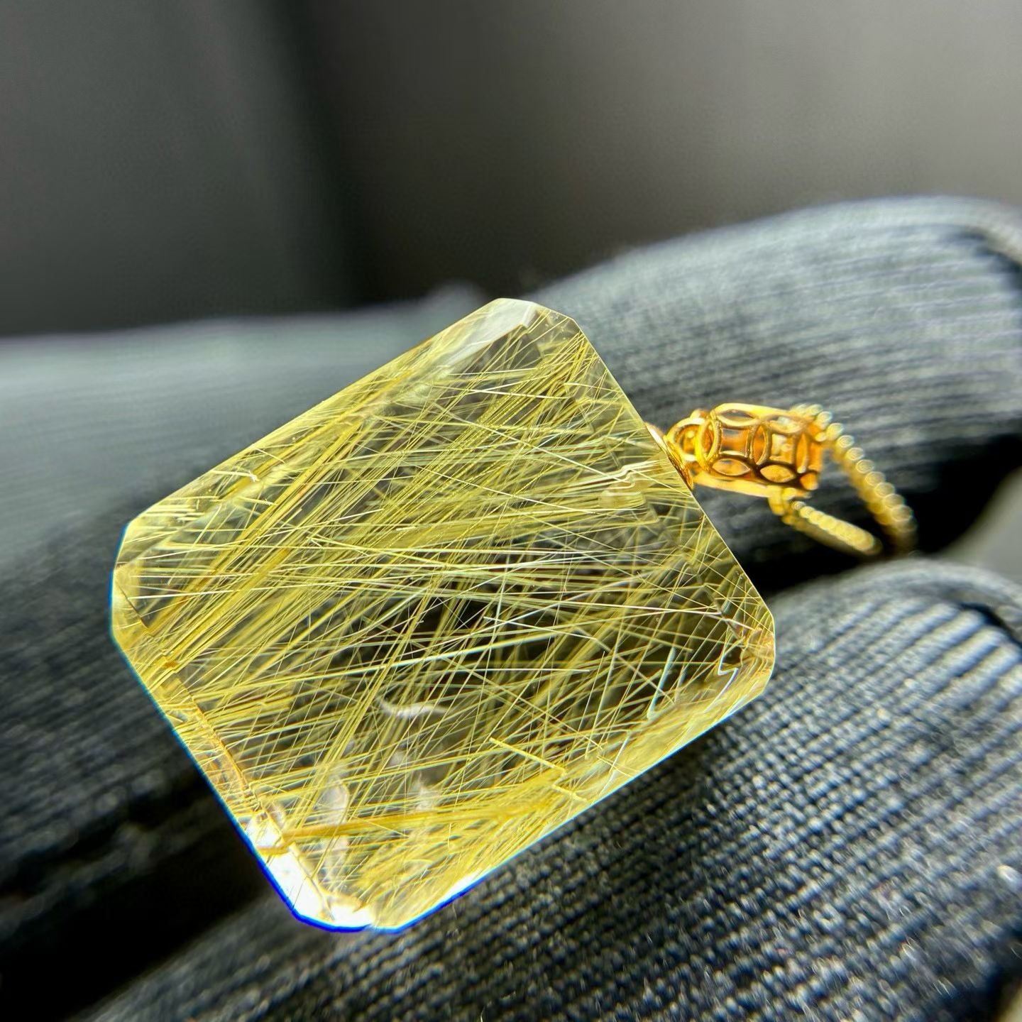 Showing the scale and clarity of the 4.4g natural golden rutilated quartz square stone.