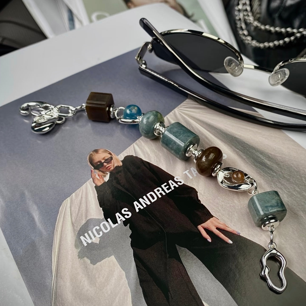 Close-up detail of blue skin Hetian jade beads and devil aquamarine with precision-carved 999 silver vacuum electroplated titanium clasp — natural stone bracelet detail shot