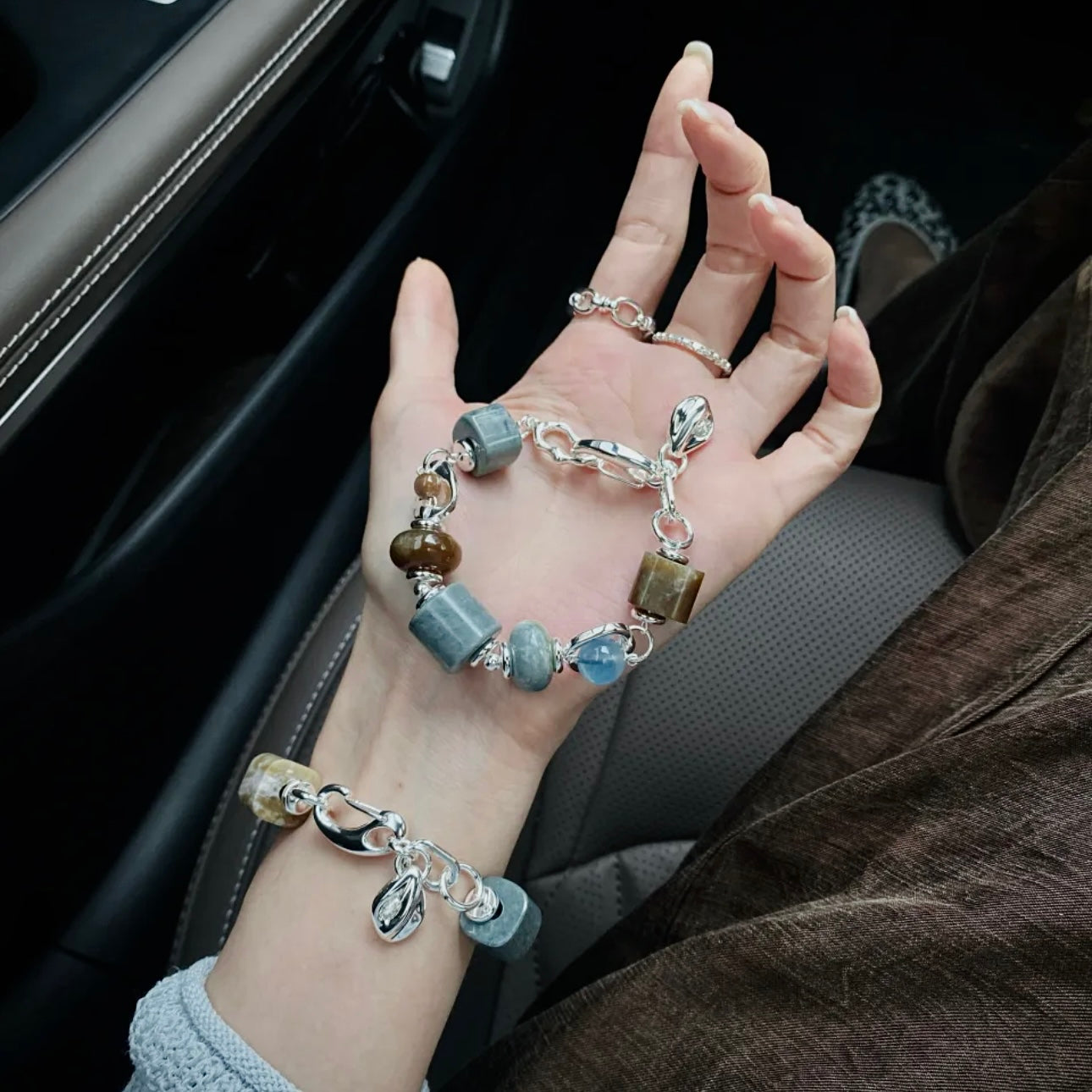 Natural Hetian jade and aquamarine bracelet worn on wrist — blue and brown contrast natural stone bracelet for everyday wear and minimalist jewellery styling