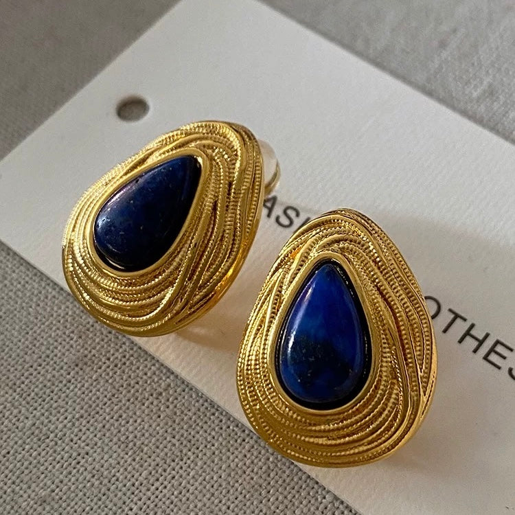 Large teardrop Lapis Lazuli stud earrings with a unique architectural swirl gold vermeil frame.