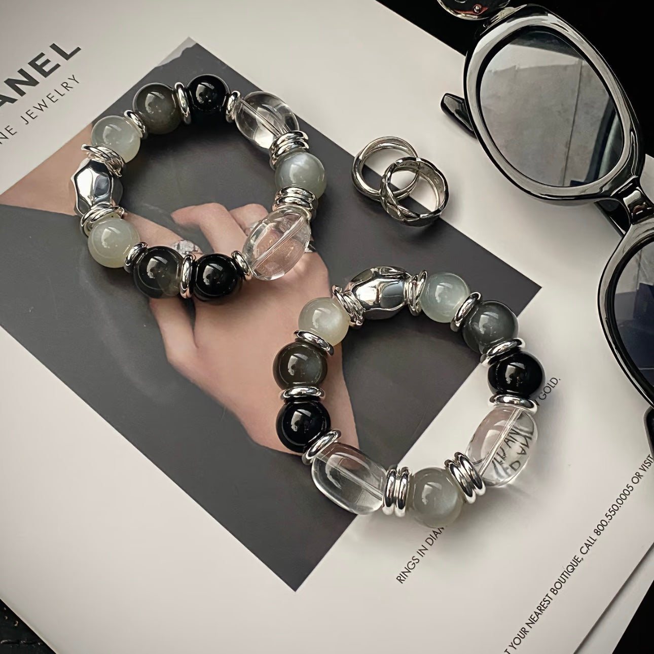 Long-termism clear quartz egg bead black agate moonstone bracelet flatlay - timeless crystal jewelry Gentle Crystals