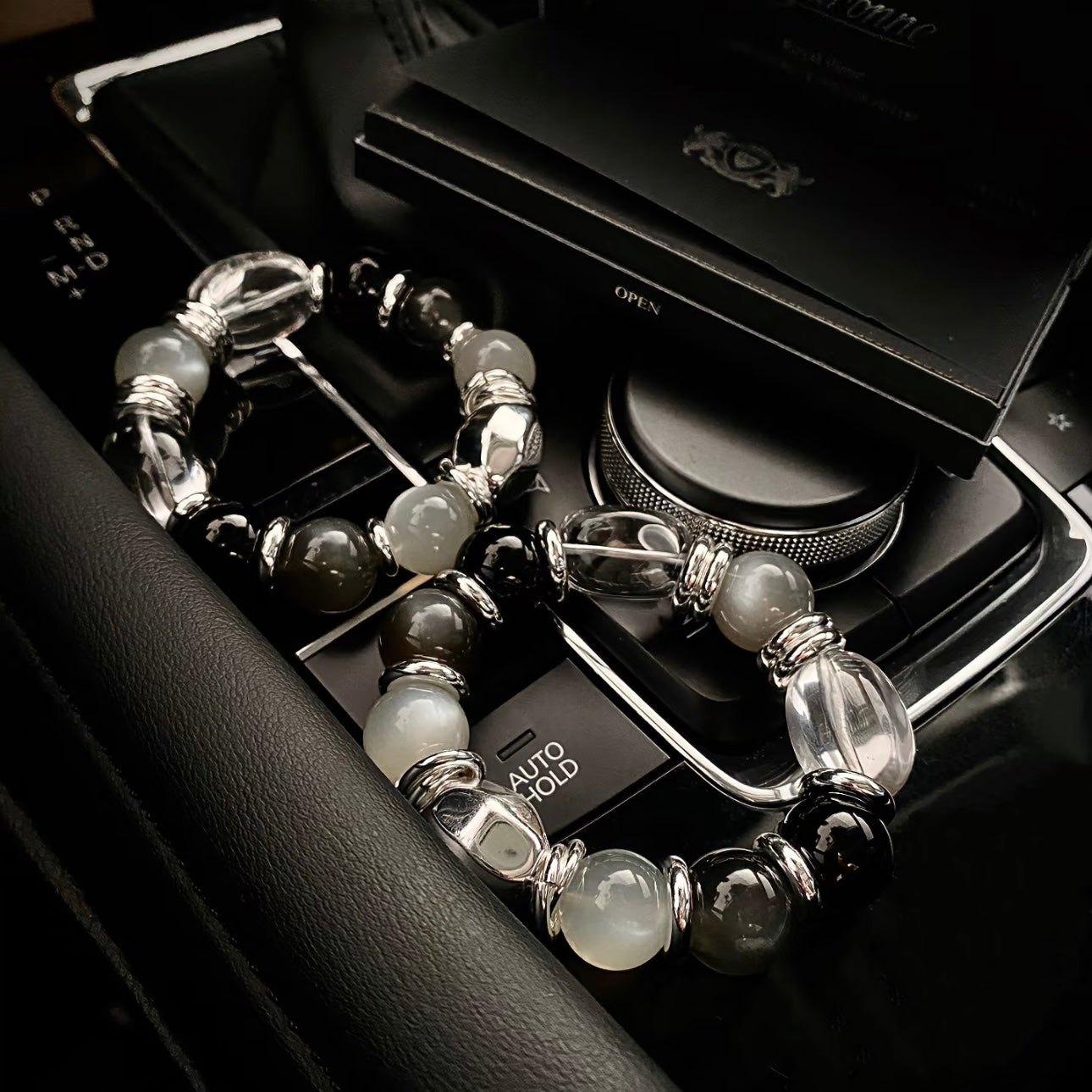 Silver moonstone milk tea grey moonstone bracelet styled flatlay - 14mm healing crystal bracelet 2026 Gentle Crystals
