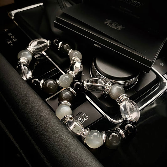 Silver moonstone milk tea grey moonstone bracelet styled flatlay - 14mm healing crystal bracelet 2026 Gentle Crystals