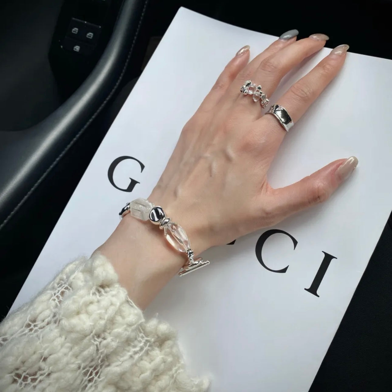 Hand model wearing Long-termism snow phantom quartz bracelet - Lemurian clear crystal healing jewelry Gentle Crystals