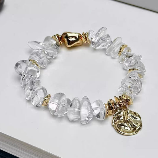 Luxury freeform clear quartz bracelet with 24K gold-plated titanium steel accessories.