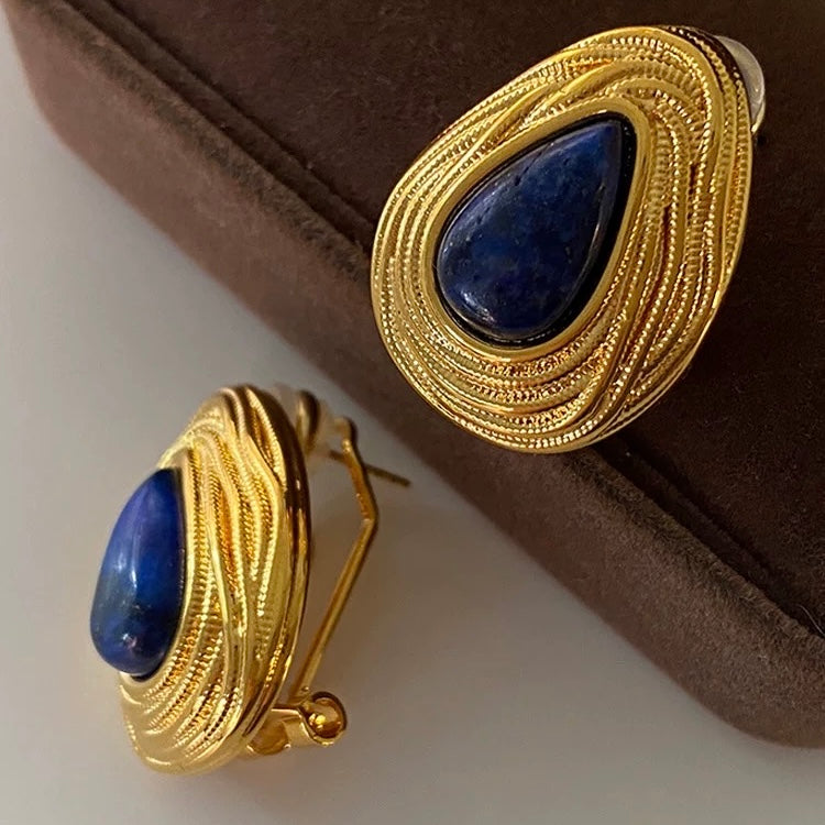 The Lapis Lazuli studs displayed in a brown velvet jewelry box, an ideal artistic gift for her.