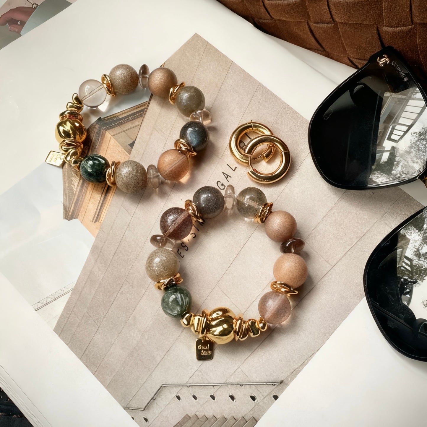 High-fashion styling of a mixed gemstone and 24K gold fusion bracelet.