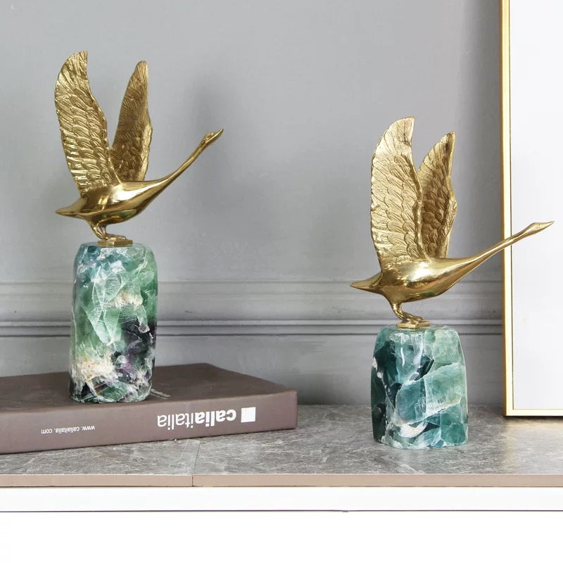 The Graceful Ascent Swan displayed in a modern home office, an elegant decor piece to elevate interior style and taste.
