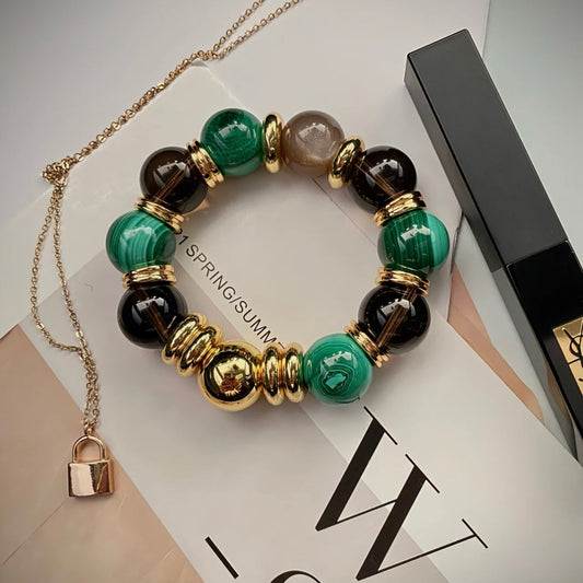 Luxury 15mm malachite and smoky quartz bracelet with 24K gold-plated architectural accents.