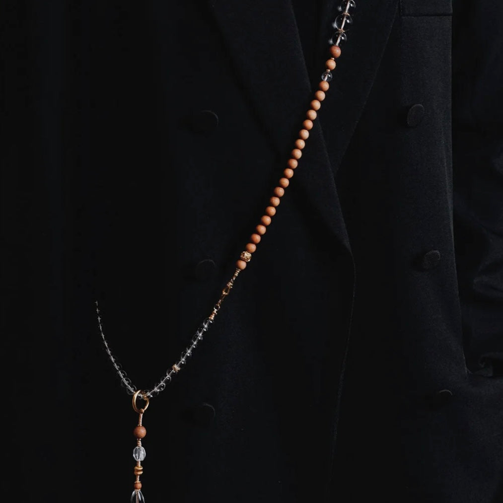 Full view of the prayer bead necklace on a model, demonstrating its versatility as an elegant healing accessory for daily wear.
