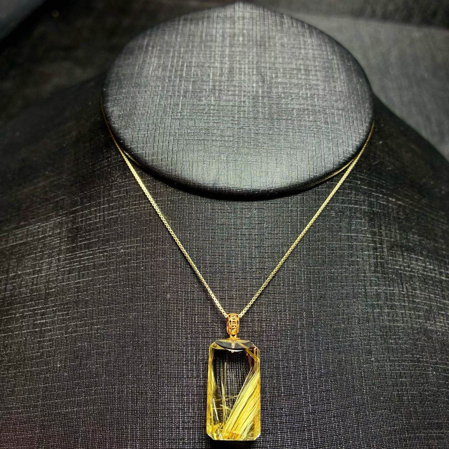Size reference for the 18K gold titanium crystal pendant, ideal for a minimalist clavicle necklace.