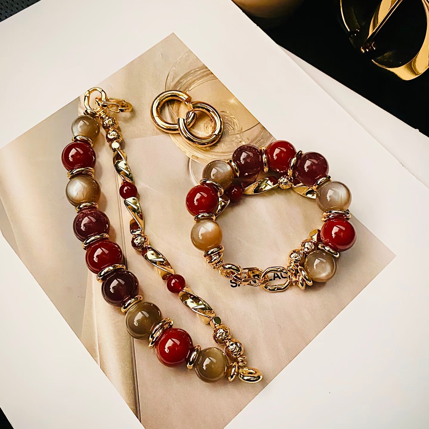 Styling the carnelian statement bracelet with luxury rings for a bold, modern boho look.